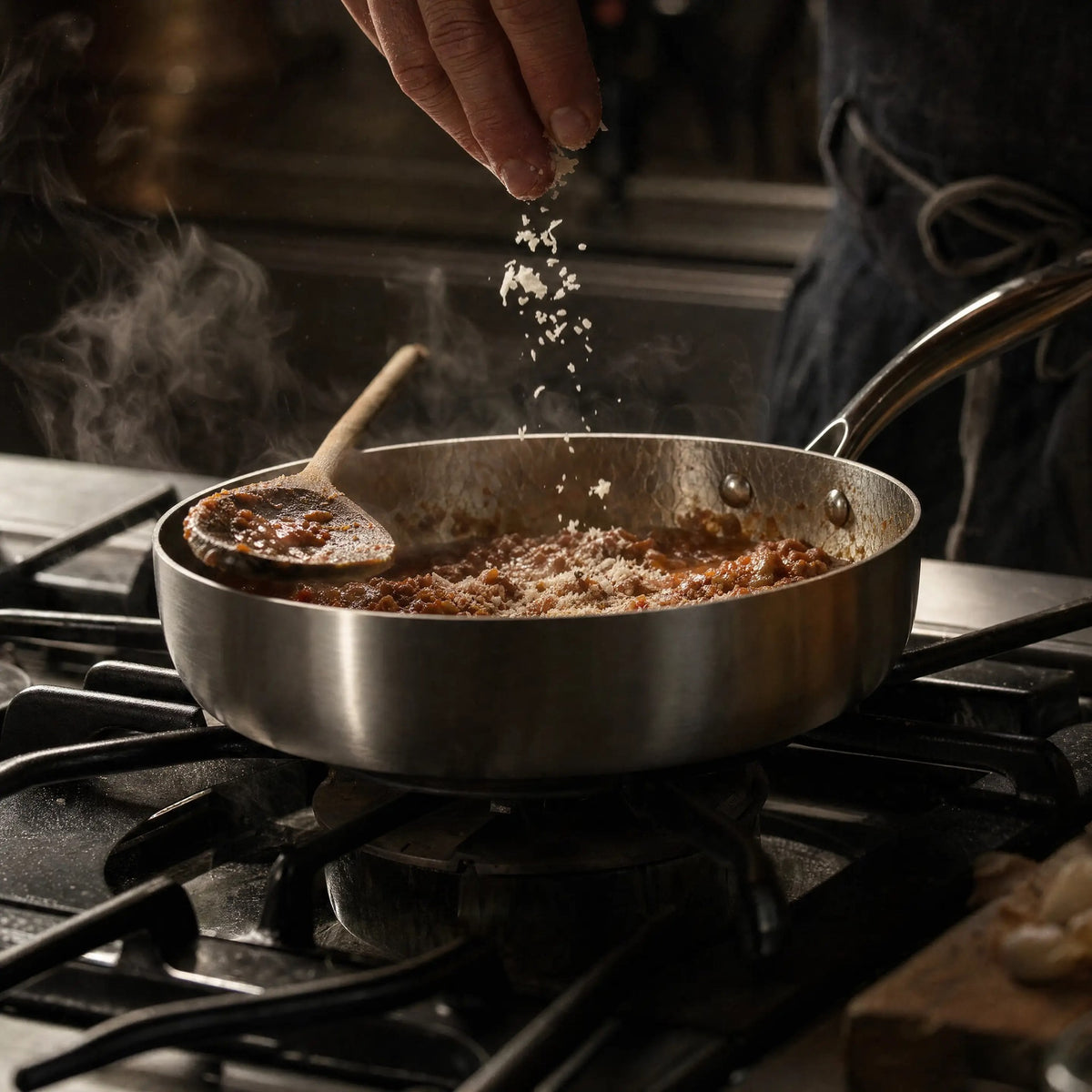 Titanium deep pan with a simmering beef ragu
