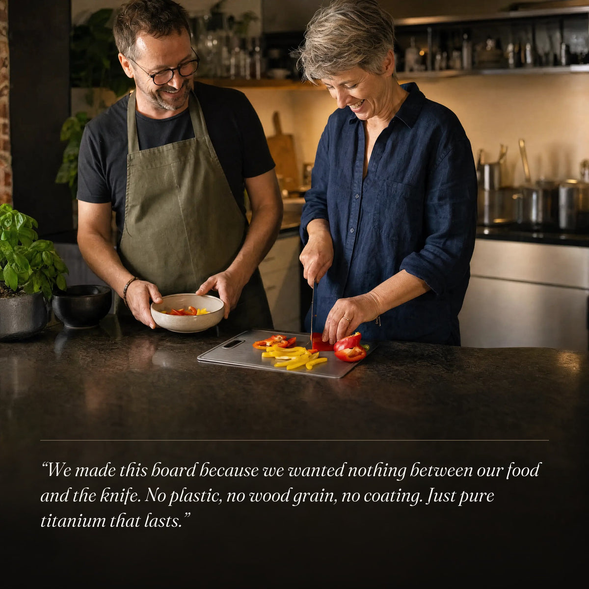 Couple preparing dinner on the titanium cutting board