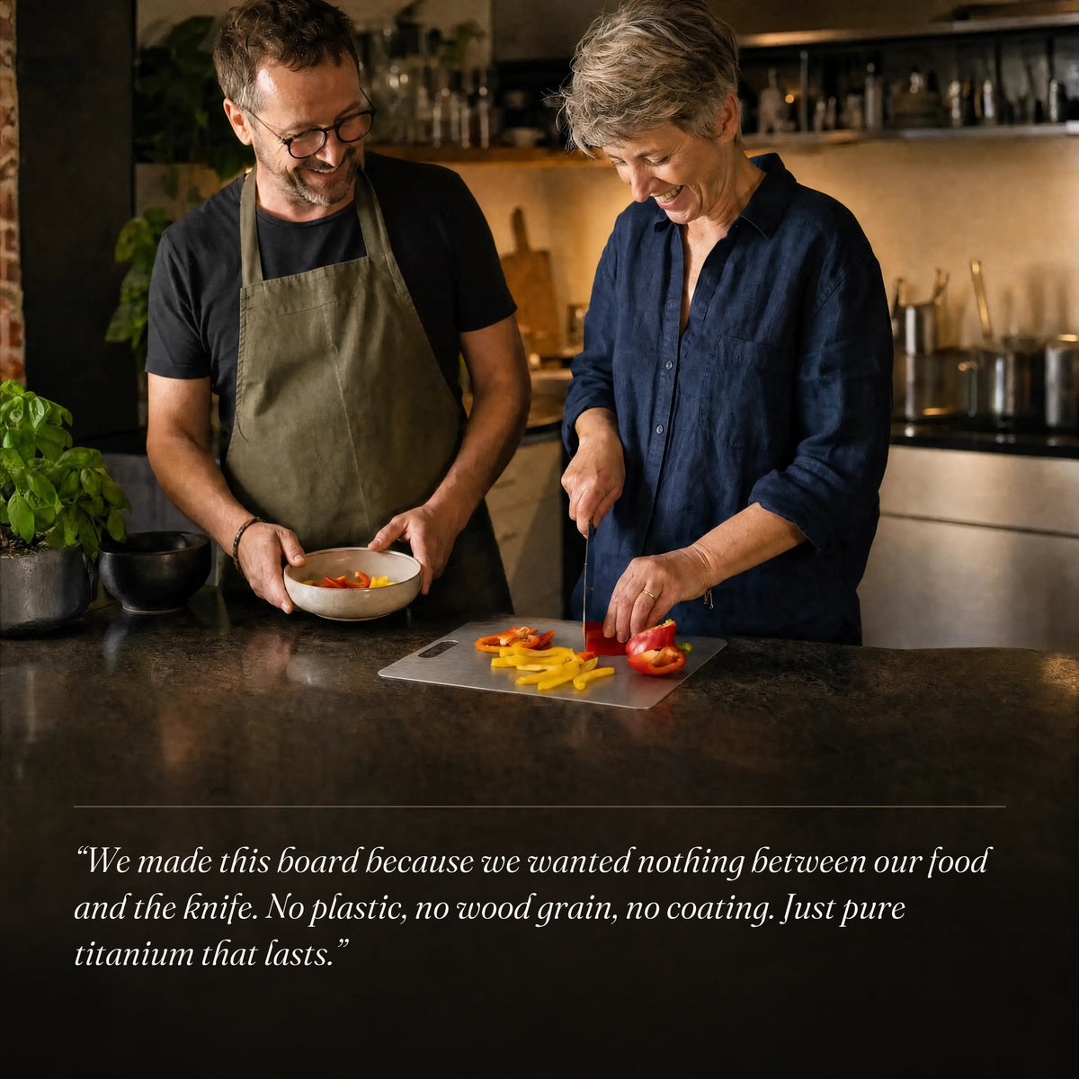 Couple preparing dinner on the titanium cutting board V1