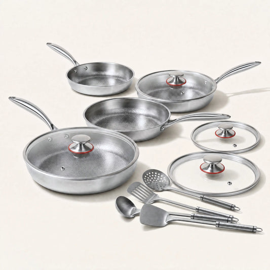 Four pure titanium hammered pans in four sizes with glass lids and titanium utensils