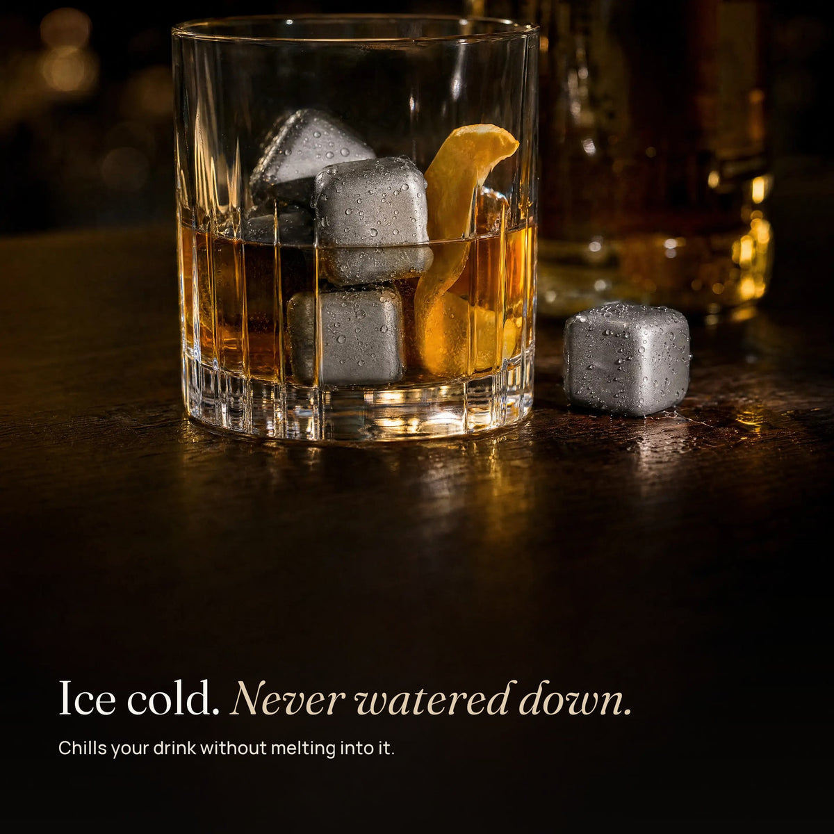 Titanium ice cubes in a glass of whiskey