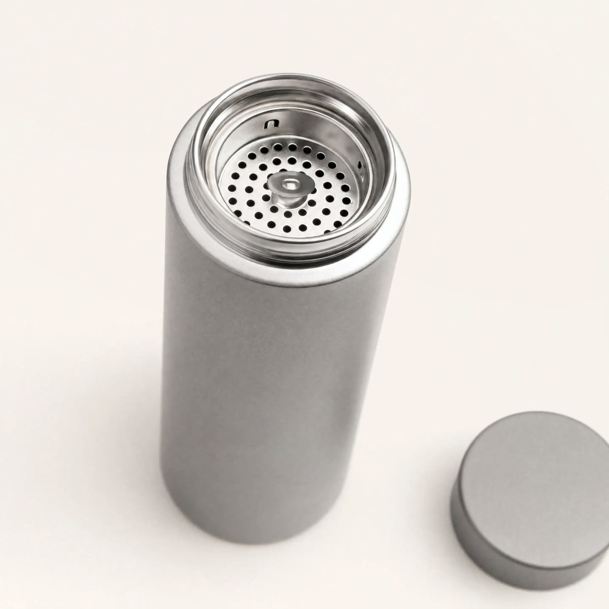 Close up of the polished rim and tea strainer inside the titanium water bottle